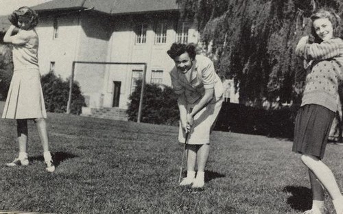 Female students playing golf