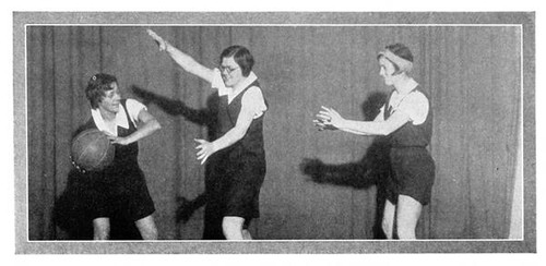 Female students playing basketball