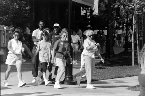 Faculty and staff walking