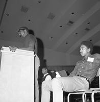 Harry Edwards at the podium delivering a speech