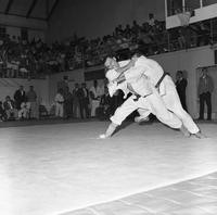 Two men engage in a judo match