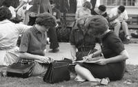Students fill out paperwork