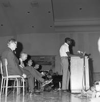 Harry Edwards speaks to an audience at a civil rights meeting