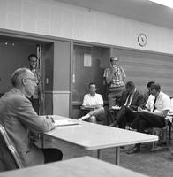 President Robert Clark meets with students in a classroom