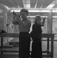 Female cadets posing at shooting range