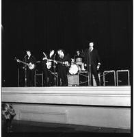 A band performs onstage
