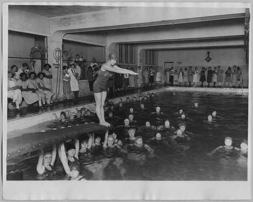 San Jose High School girls swimming in indoor pool [ca. 1940]