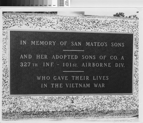 Dedication plaque at Library flagpole