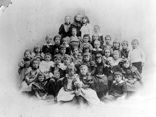 Old Santa Ana School, children grouped with the teacher