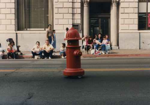 A mobile "fire plug" makes its way down Main Street during the Santa Ana Golden City Days parade, October 17, 1987