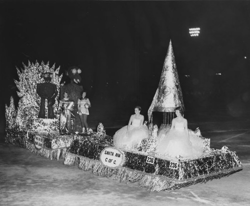 Santa Ana Chamber of Commerce float in a night-time parade