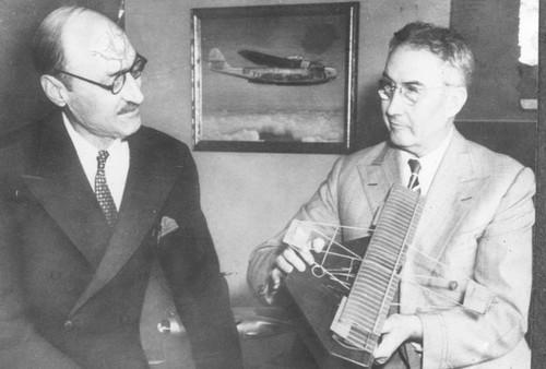 Glenn L. Martin showing Percy F. Rice a model of one of his early airplanes