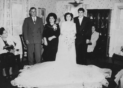 Newlyweds Daniel and Lupe Herrera pose with relatives at the reception