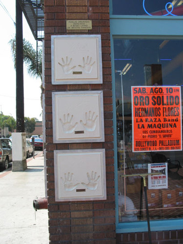 Handprints of famous artists on the Ritmo Latino music store on the corner of Fourth Street and French Street, August 2002
