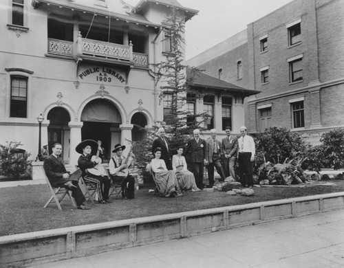 Carnegie Library with a group of musicians and members of the Breakfast Club on the front grass