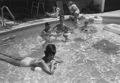 Home pool with young children and parents