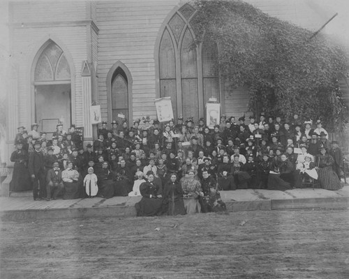 Women's Temperance League members seated outside the First Methodist Church on 6th and Bush