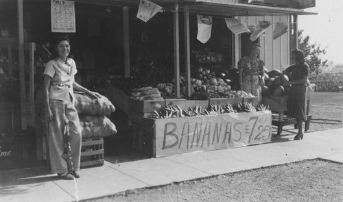 Shoppers in the open-air section of Phil's Food Market on 1806 W. First Street