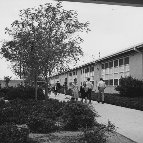 Students walk by a classroom building at Santa Ana High School at 520 W. Walnut