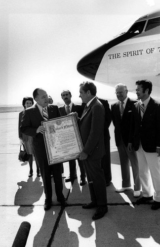 President Nixon receiving a proclamation from Lorin Griset on April 8, 1973