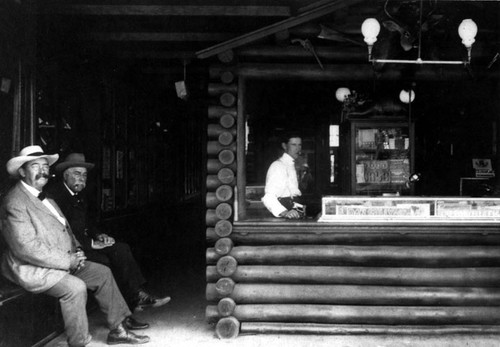 Log Cabin Cigar Store at 220 W. 4th St. in the 1900's