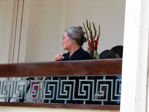 An elder in deep thought at the Vietnamese Catholic Center on the corner of Harbor and Seventeenth