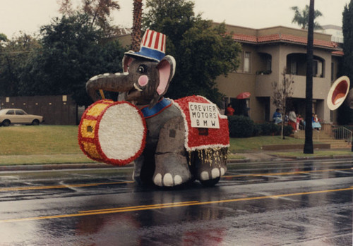 Elephant float, complete with Uncle Sam hat, moving up Broadway in the third annual Toys on Parade in Santa Ana, December 6, 1986