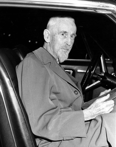 Man seated in a car who may be William H. Spurgeon Jr. about 1969