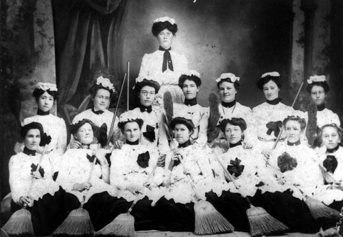 Group of women employed in the Santa Ana downtown area in their Marching Club outfits