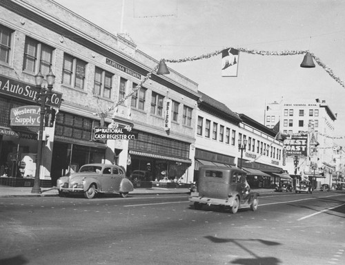 West side of N. Main Street between 2nd and 3rd Streets during Christmas time in the 1930's