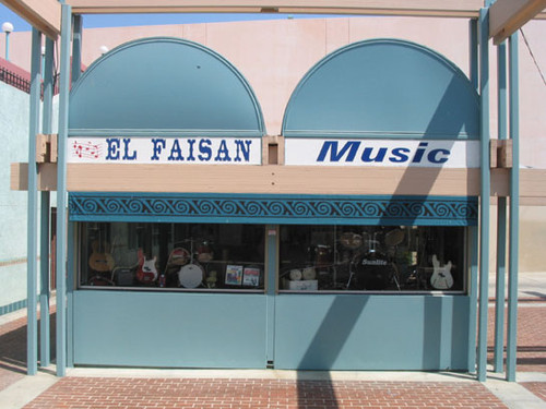 Window display with musical instruments at a shop in El Faisan on Fourth Street, August 2002