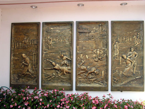 Gold etched murals at the Vietnamese Catholic Center on the corner of Harbor and Seventeenth