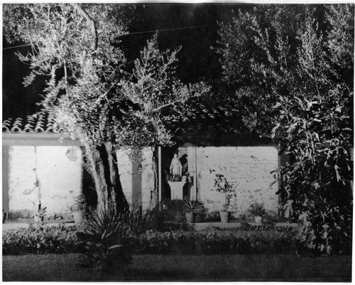 Adobe Wall With Statue of Mary