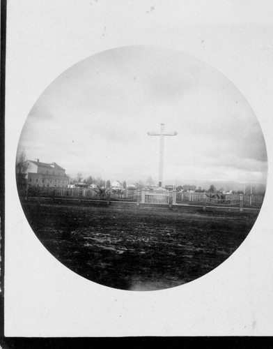 Mission Santa Clara Cross with Santa Clara College campus in background, c. 1887