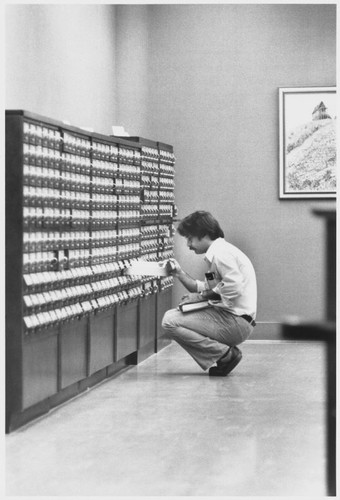 Student using Library Card Catalog in Orradre Library, ca. 1979