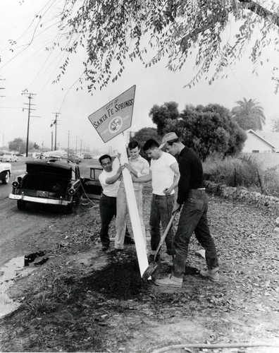 Installing city limit sign