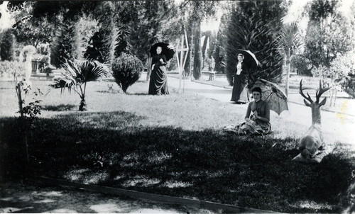 Nimock family on lawn with stag sculpture