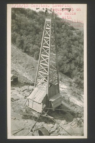 Casitas, lowering equipment on wire cable with traveling block. August 8, 1912