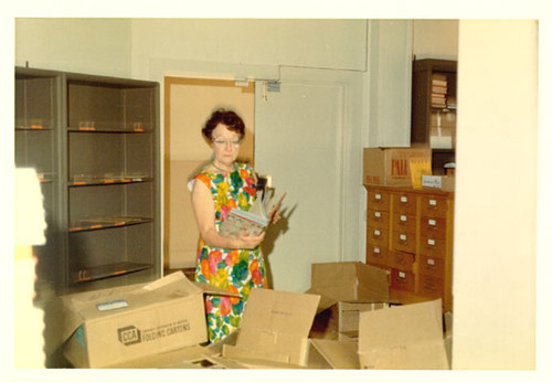 [Staff examining receiving inventory in the Order Department at Main Library]
