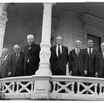 Seven founding members of the University Club of Sacramento gathered together at the organization's headquarters