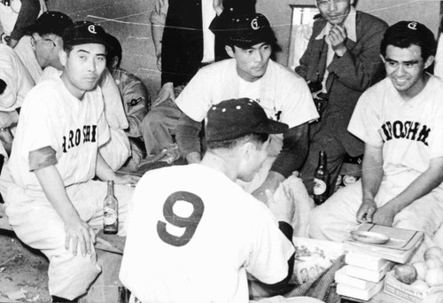 Ben Mitsuyoshi in dugout at Hiroshima Carps baseball game