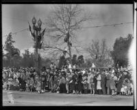 Boys in tree on the route of the Tournament of Roses Parade, Pasadena, 1932