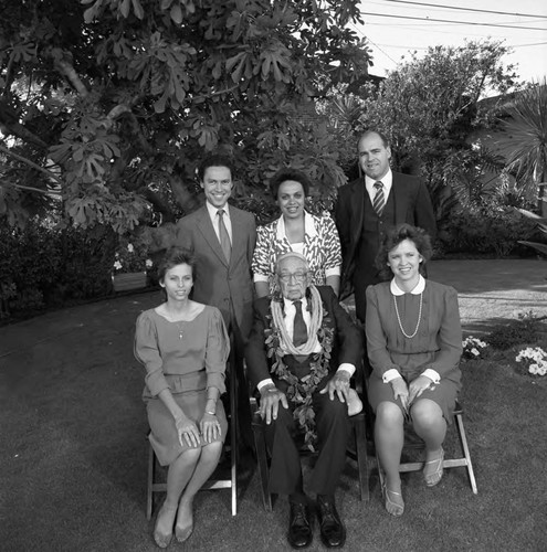 Dr. H. Claude Hudson posing with his grandchildren during his 100th birthday celebration, Los Angeles, 1986