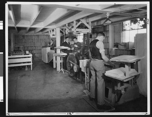Workers making books for the blind at the Universal Braille Press, in December 1933