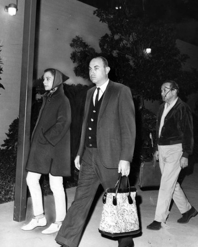 Hedy Lamarr leaves with her attorney, Arthur G. Lawrence