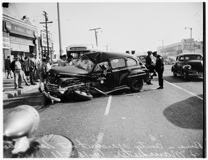Collision... bus versus autos... San Pedro Street and East Manchester Avenue, 1951