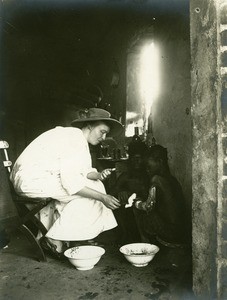 Missionary woman treating a man, in Gabon