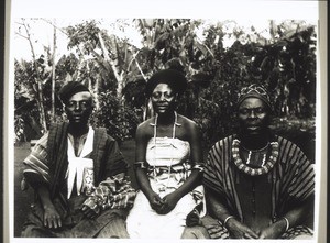 Cameroon, Grassfields, Fumban. A newly-married king's daughter, on the right her brother, on the left her husband
