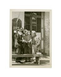 Isidore B. Dockweiler talking with men, circa 1930s