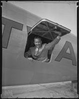 Bill Henry, Los Angeles Times sports editor arrives home from Europe in a TWA plane, Los Angeles County, 1935